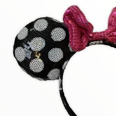 Close-up of Minnie polka dot ears with pink sequin bow